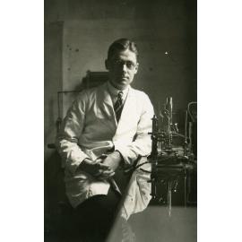 Howard Florey with microscope, c1930s