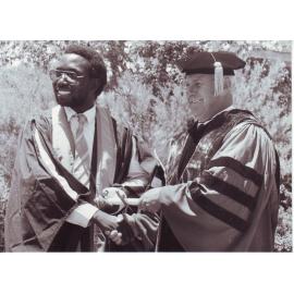 Barrie Thistlethwayte Congratulating Graduating International Student, 1989