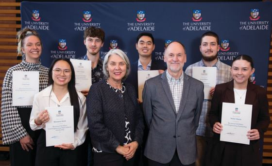Representatives from Raymond McMillan Constructions with scholarship recipients, October 2023